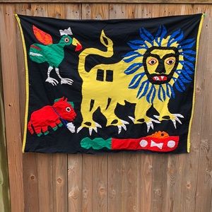 Hand sewn cloth wall hanging in primitive design & colors with Lion, bird & bull